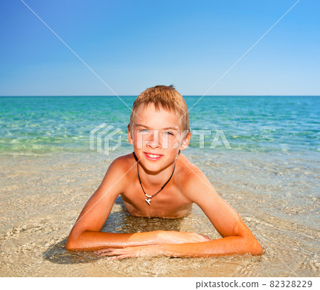 Boy on a beach Boy on a beach 82328229