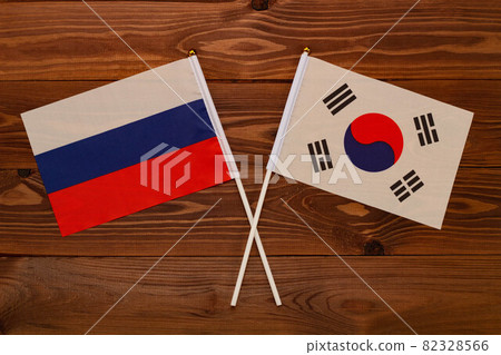 Flag of Russia and flag of South Korea crossed with each other. The image illustrates the relationship between countries. Photography for video news on TV and articles on the Internet and media. Flag of Russia and flag of South Korea crossed with each other. The image illustrates the relationship between countries. Photography for video news on TV and articles on the Internet and media. 82328566