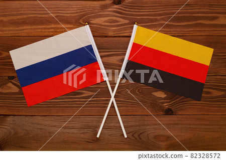 Flag of Russia and flag of Germany crossed with each other. The image illustrates the relationship between countries. Photography for video news on TV and articles on the Internet and media. Flag of Russia and flag of Germany crossed with each other. The image illustrates the relationship between countries. Photography for video news on TV and articles on the Internet and media. 82328572