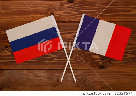 Flag of Russia and flag of France crossed with each other. The image illustrates the relationship between countries. Photography for video news on TV and articles on the Internet and media. Flag of Russia and flag of France crossed with each other. The image illustrates the relationship between countries. Photography for video news on TV and articles on the Internet and media. 82328574