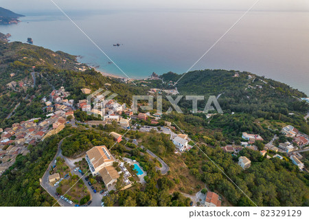 Sunset over coast of Corfu with Pelekas village, Greece. 82329129