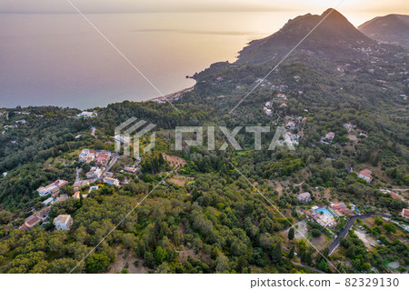 Sunset over coast of Corfu with Saint George mountain, Greece. Sunset over coast of Corfu with Saint George mountain, Greece. 82329130