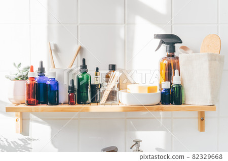 Close up of reusable cosmetic bottles on bamboo shelf Close up of reusable cosmetic bottles on bamboo shelf 82329668