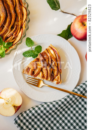Top view of apple cake on kitchen table 82329823