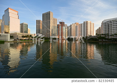 City of Miami, Florida skyline reflected in Biscayne Bay at sunrise. 82330485