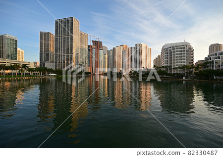 City of Miami, Florida skyline reflected in Biscayne Bay at sunrise. 82330487