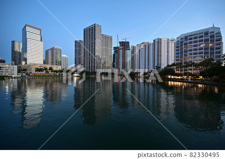 City of Miami, Florida skyline reflected in Biscayne Bay in pre dawn light. City of Miami, Florida skyline reflected in Biscayne Bay in pre dawn light. 82330495