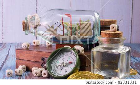 boat in bottle on wood table for travel or transport concept boat in bottle on wood table for travel or transport concept 82331331