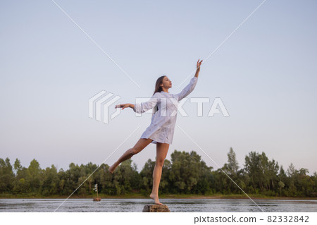 Outdoors fashion photo of beautiful bohemian lady at river. Outdoors fashion photo of beautiful bohemian lady at river. 82332842