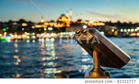 Touristic binoculars at Galata Bridge with Istanbul cityscape background at night Touristic binoculars at Galata Bridge with Istanbul cityscape background at night 82333717