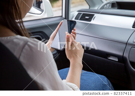 Women sitting in the passenger seat Women searching in the passenger seat Women searching Women sitting in the passenger seat Women searching in the passenger seat Women searching 82337411