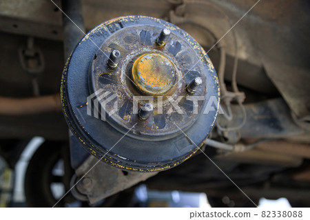 A rear hub of the car after removing a tire and wheel, maintaining a brake and wheel system, car jack-up for change a car wheel, Close-up shot A rear hub of the car after removing a tire and wheel, maintaining a brake and wheel system, car jack-up for change a car wheel, Close-up shot 82338088
