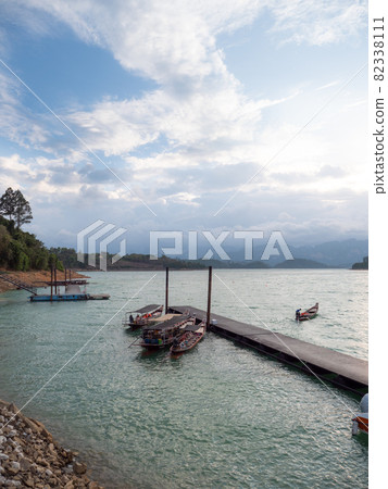 Scenic landscape of big river and reservoir dam with mountain and nature forest 82338111