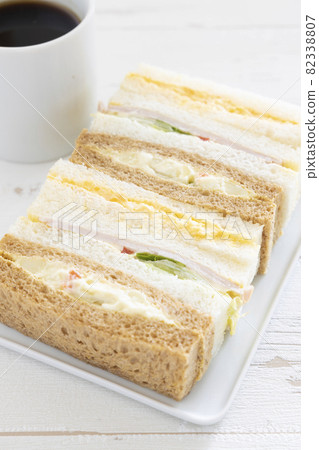 Delicious mixed sandwiches and hot coffee 82338807