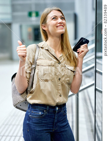 Young woman traveler looking at itinerary map at metro station 82339489