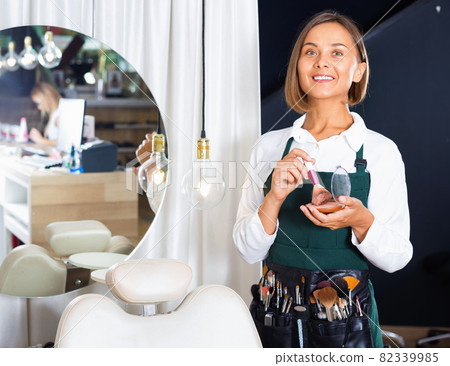 Portrait of adult woman makeup artist standing in the salon Portrait of adult woman makeup artist standing in the salon 82339985