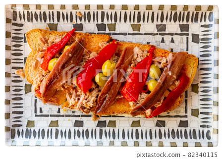 Torrada de anchoas, appetizing toast with anchovies 82340115