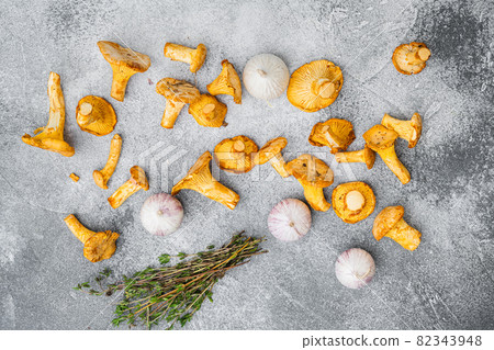 Chanterelle mushrooms, on gray stone table background, top view flat lay 82343948