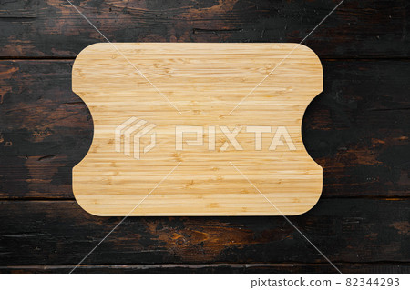 Cutting Board On Dark Wood Background Top View Stock Photo