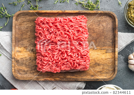 Meatball ingredients Veal or mixed homemade minced meat with spices and herbs, on gray stone background, top view flat lay 82344611