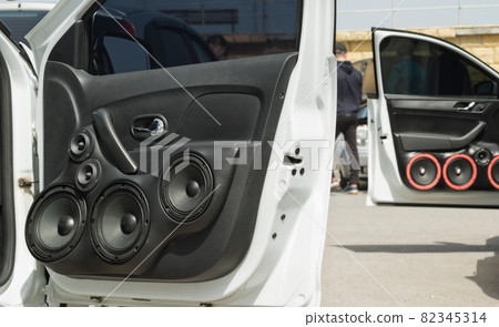 car with a large number of installed audio speakers and subwoofer 82345314