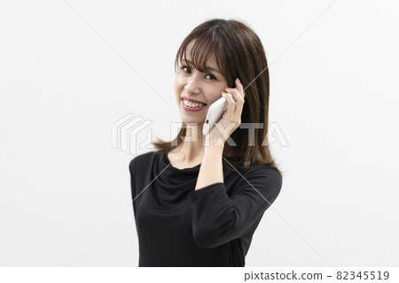 Woman using a smartphone Woman using a smartphone 82345519