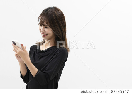Woman using a smartphone Woman using a smartphone 82345547