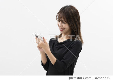 Woman using a smartphone Woman using a smartphone 82345549