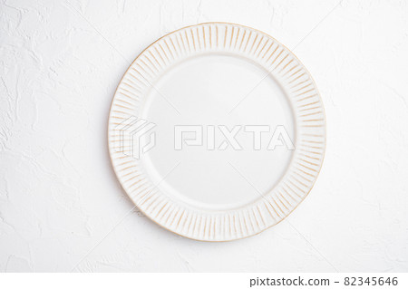 White plate empty utensil with copy space for text or food with copy space for text or food, top view flat lay , on white stone table background White plate empty utensil with copy space for text or food with copy space for text or food, top view flat lay , on white stone table background 82345646