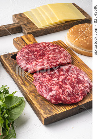 Beef minced meat cutlet, on white stone background 82345696