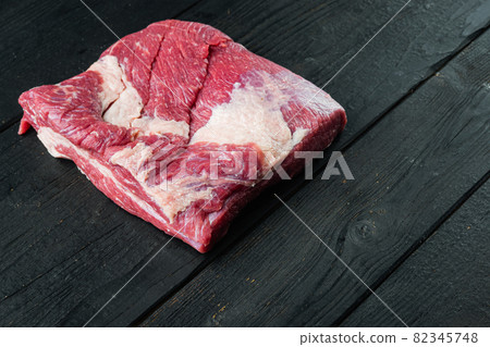 Raw veal calf brisket beef, on black wooden table background, with copy space for text Raw veal calf brisket beef, on black wooden table background, with copy space for text 82345748