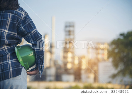 Woman engineer holding Green hard hats safety officer or inspector. Eco sustainable worker hands holding hardhat green work helmet Engineering. Woman Green business ecosystem environment engineering Woman engineer holding Green hard hats safety officer or inspector. Eco sustainable worker hands holding hardhat green work helmet Engineering. Woman Green business ecosystem environment engineering 82348931