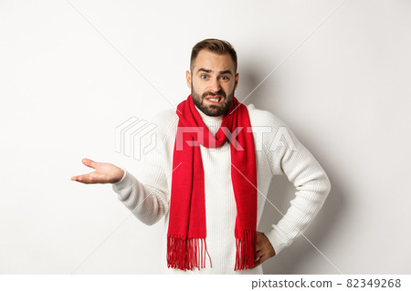 Clueless bearded man dont know, shrugging and saying sorry, standing puzzled against white background Clueless bearded man dont know, shrugging and saying sorry, standing puzzled against white background 82349268