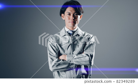 A businessman in work clothes with his arms folded 82349289