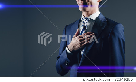 Image of a businessman who puts his hand on his chest 82349299