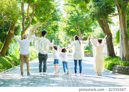 Three generations family connecting hands 82350367