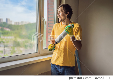 Builder or handyman is engaged in the repair or installation of windows Builder or handyman is engaged in the repair or installation of windows 82351995
