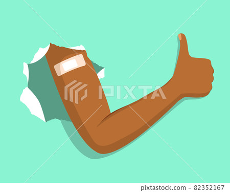 Black person arm breaks through green paper shows adhesive bandage after vaccination making thumb up gesture vaccine booster positive concept 82352167