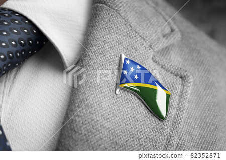 Metal badge with the flag of Solomon Islands on a suit lapel 82352871
