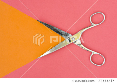 Colorful background with metal scissors 82353217