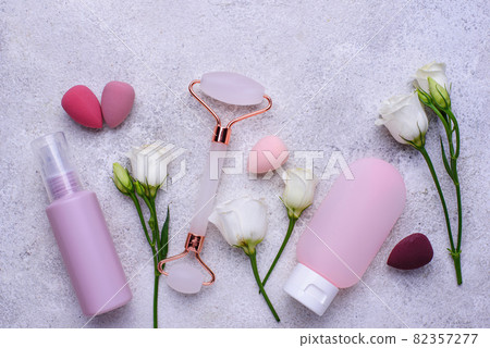 Rose quartz roller and cosmetic tubes Rose quartz roller and cosmetic tubes 82357277