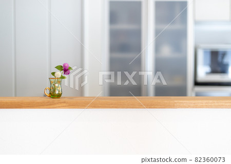 Newly built detached kitchen with flowers on the counter 82360073