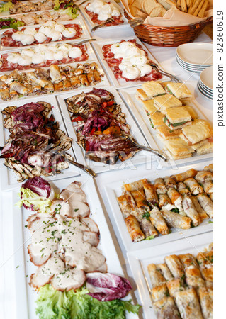 Traditional Apulean antipasti served on table during Italian wedding or celebration, above view 82360619