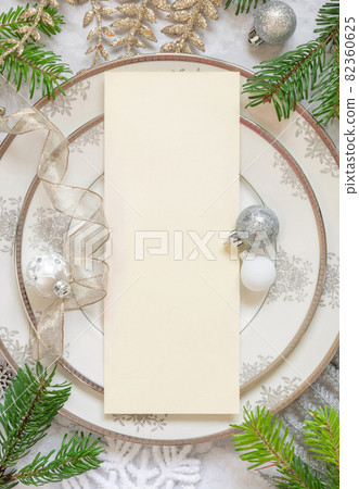 Festive table setting of with fir tree branches and Christmas decorations. Mockup Festive table setting of with fir tree branches and Christmas decorations. Mockup 82360625