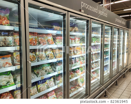 KUALA LUMPUR, MALAYSIA -MARCH 9, 2020: Frozen foods are displayed on the rack inside the large chiller in the supermarket. Displayed and arranged by the brand to make it easy for the customer.  82361945