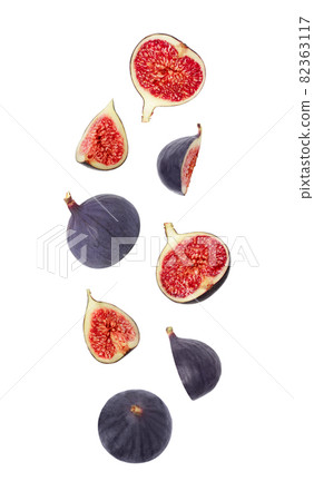 Falling figs isolated on a white background. Flying fruits for packaging design. Flying down figs. Falling figs isolated on a white background. Flying fruits for packaging design. Flying down figs. 82363117