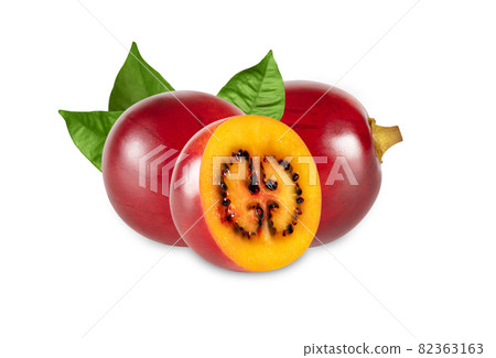 Tamarillo fruit closeup isolated on a white background. Fresh ripe fruit with leaves. Tamarillo fruit closeup isolated on a white background. Fresh ripe fruit with leaves. 82363163
