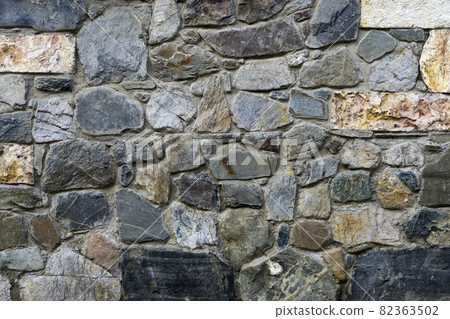 texture, the background of the wall lined with natural stones  different shapes sizes and colors 82363502