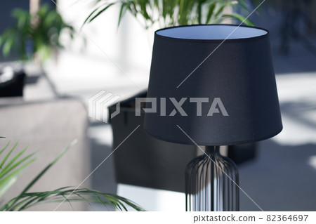 Modern black lamp complementing interior at living room Modern black lamp complementing interior at living room 82364697