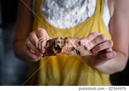 Rye sticks with chocolate breaks a woman baker Rye sticks with chocolate breaks a woman baker 82364979